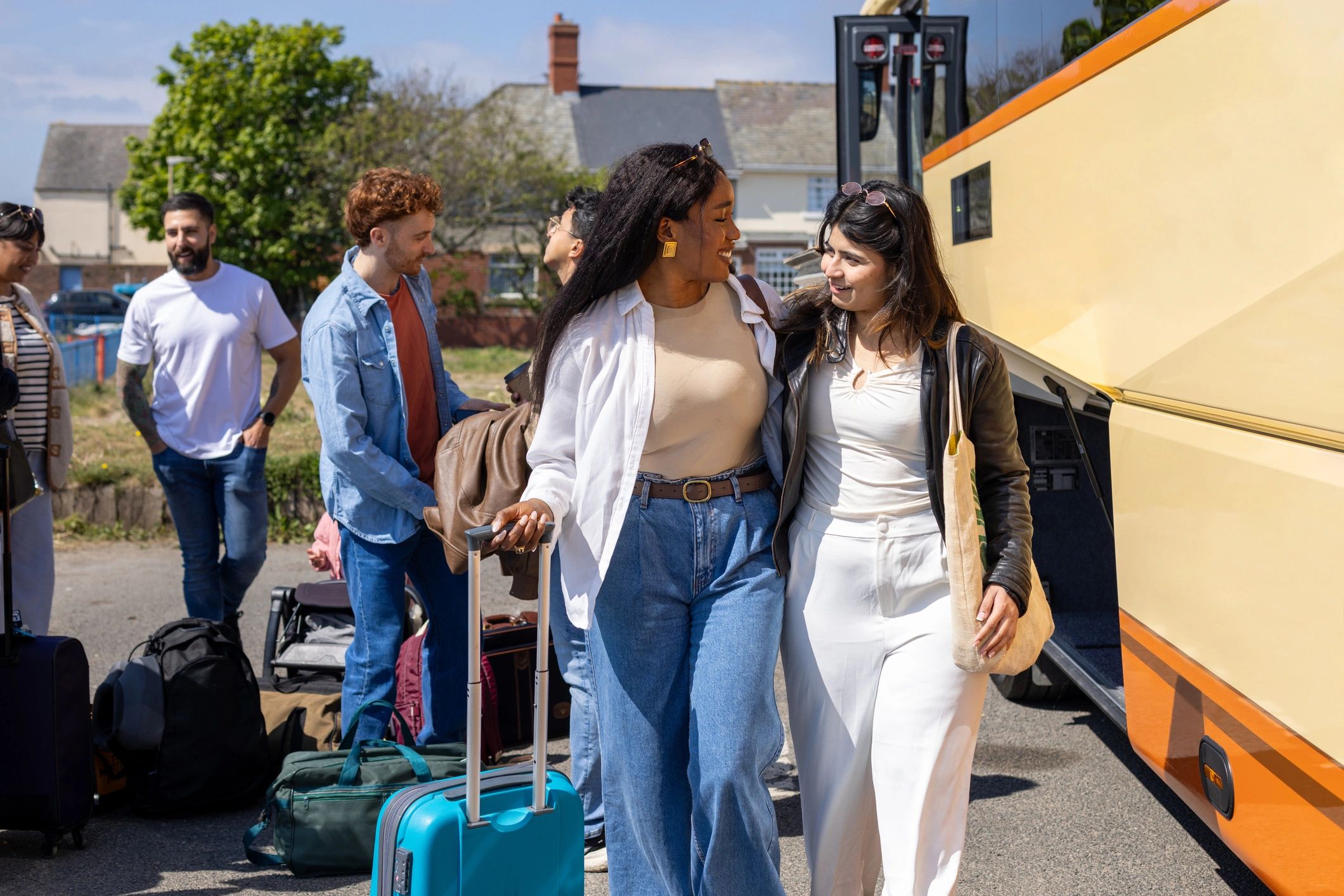 Travelers together with luggage, reflecting discovery, planning, and shared experiences